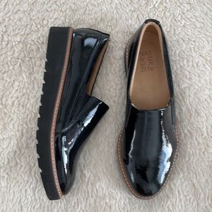 Black patent leather slip on shoes